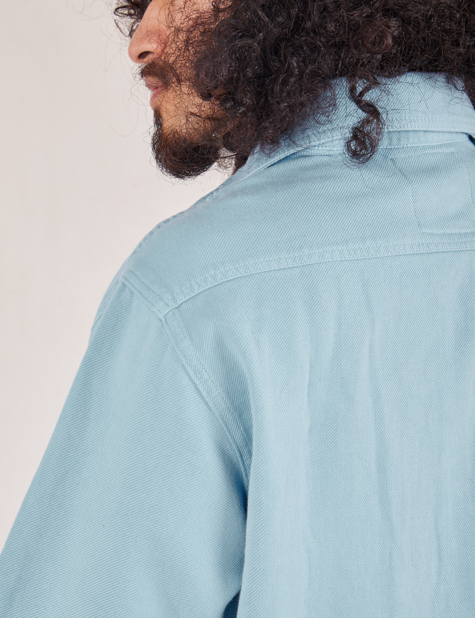 Back shoulder close up of Flannel Overshirt in Baby Blue on Jesse
