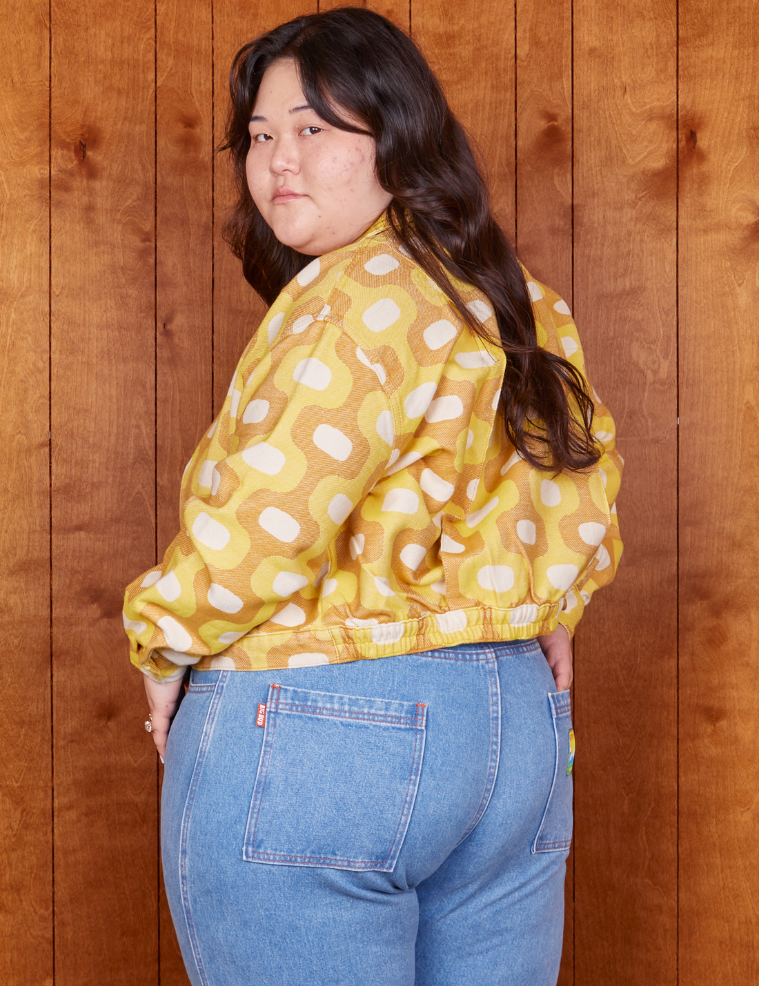 Angled view of Jacquard Ricky Jacket in Yellow worn by Ashley