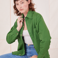 Alex is wearing Oversize Overshirt in Lawn Green with a vintage off-white Cropped Tank Top underneath