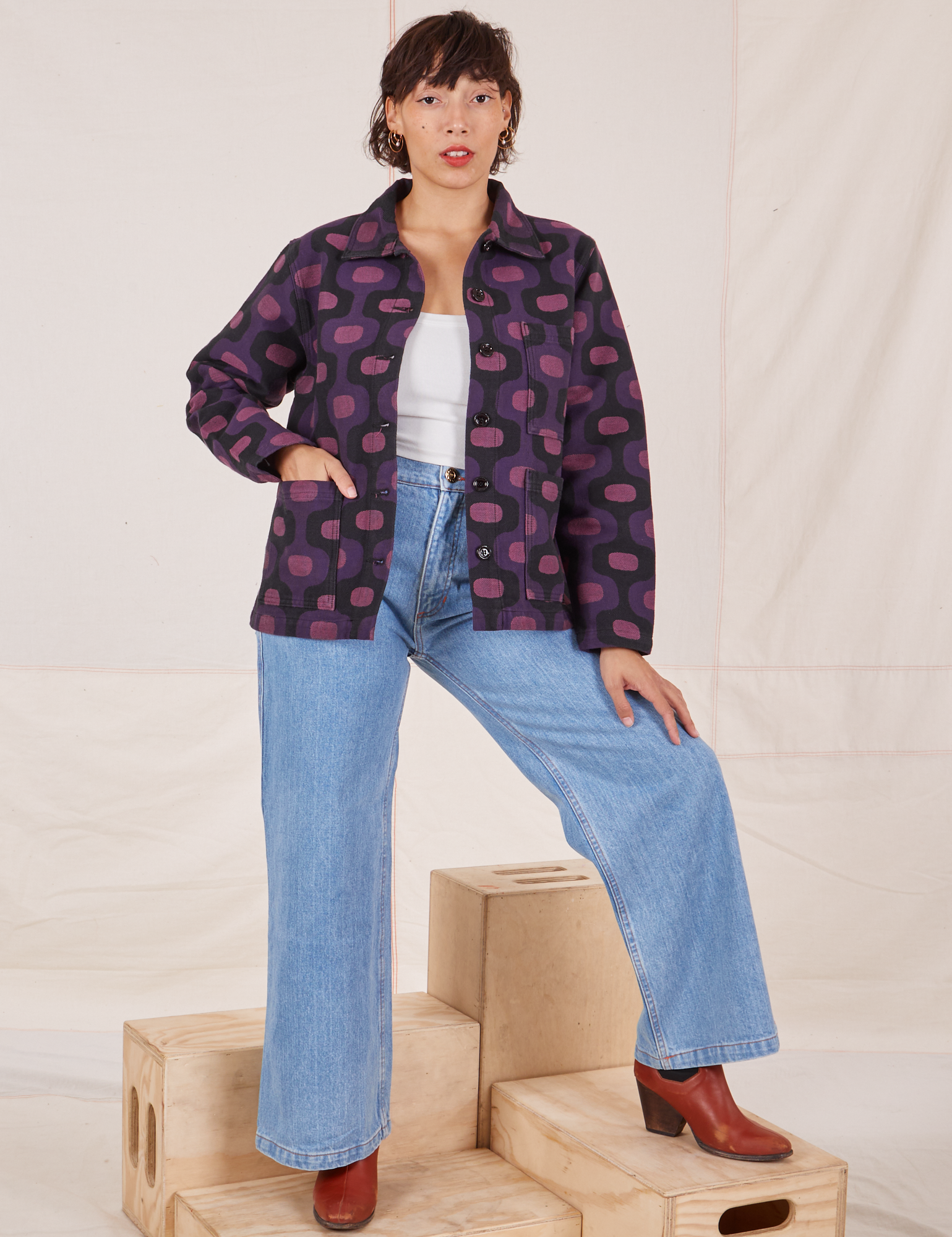 Tiara is wearing  Purple Tile Jacquard Work Jacket and light wash Frontier Jeans
