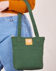 Over-Shoulder Zip Mini Tote in Dark Emerald Green worn on model's arm