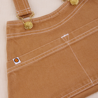 Overall Handbag in Tan. White contrast stitching. Brass sun baby buttons and hardware.