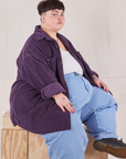 Jordan is wearing Corduroy Overshirt in Nebula Purple with a vintage off-white Cropped Tank Top underneath paired with light wash Denim Trouser Jeans