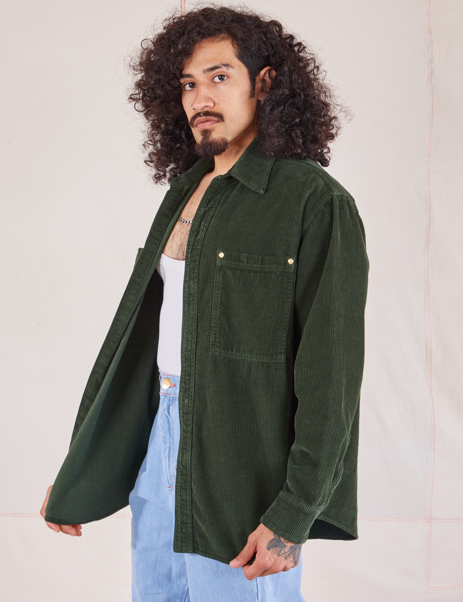 Angled front view of Corduroy Overshirt in Swamp Green on Jesse