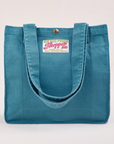 Shopper Tote Bag in Marine Blue with straps hanging down front of bag