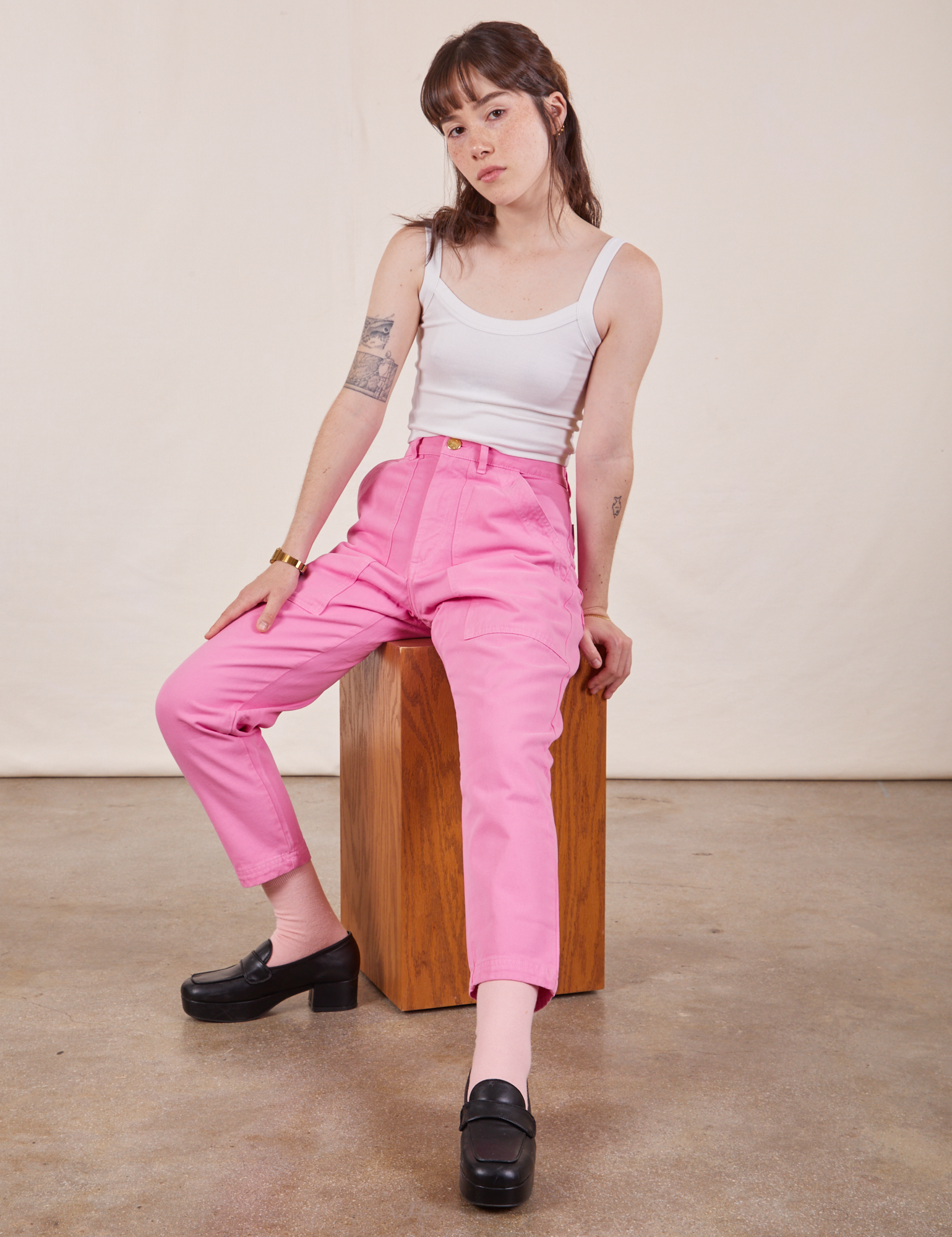 Hana is wearing Petite Pencil Pants in Bubblegum Pink and vintage off-white Cropped Cami
