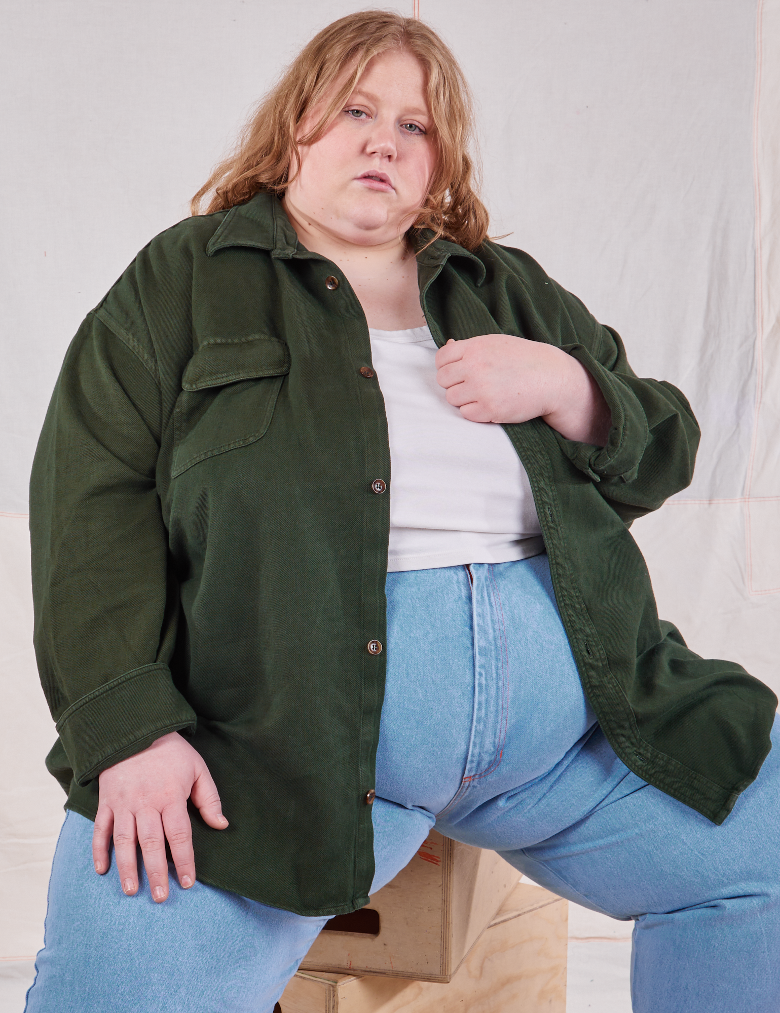 Catie is wearing Flannel Overshirt in Swamp Green and vintage off-white Cropped Tank Top