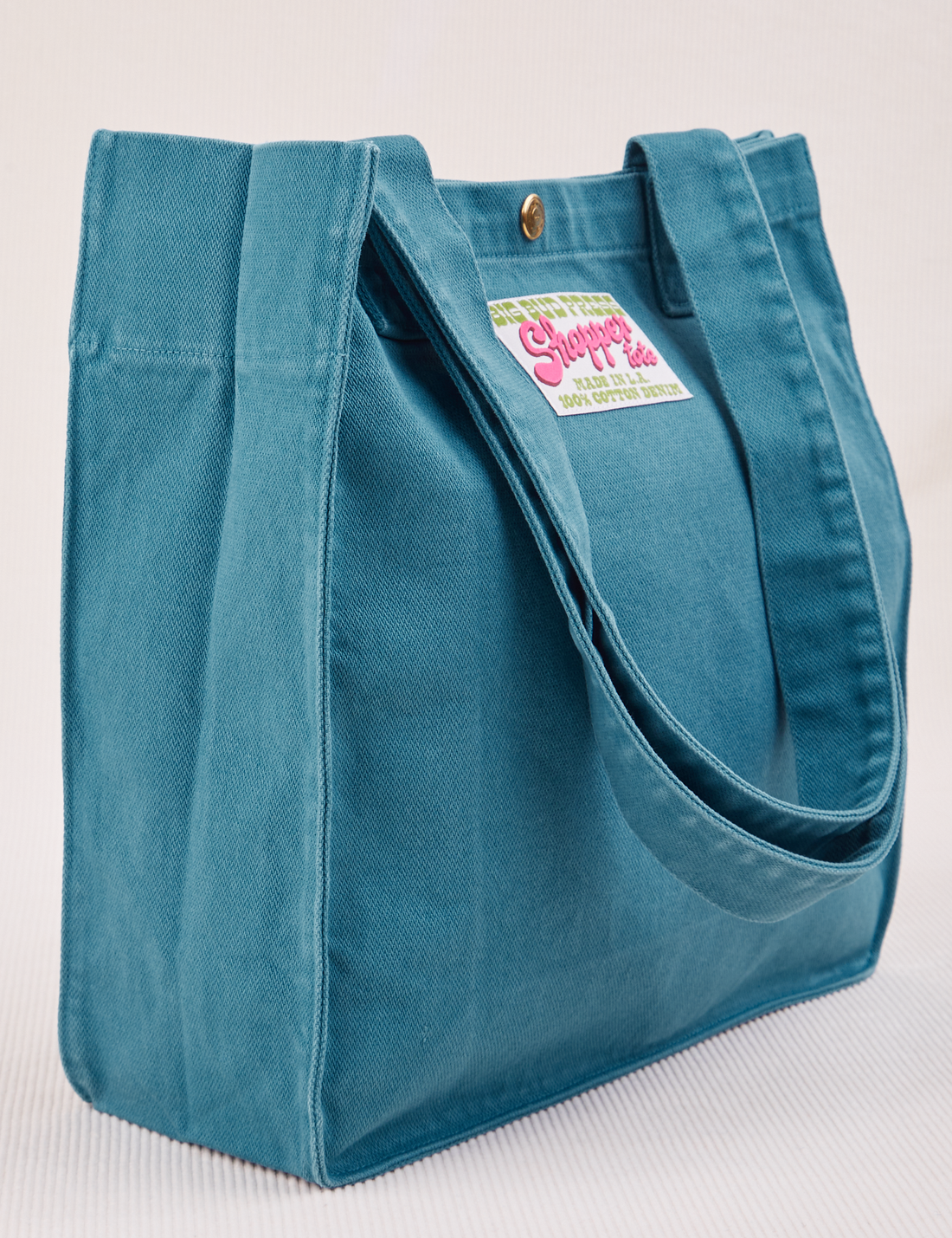 Angled view of Shopper Tote Bag in Marine Blue