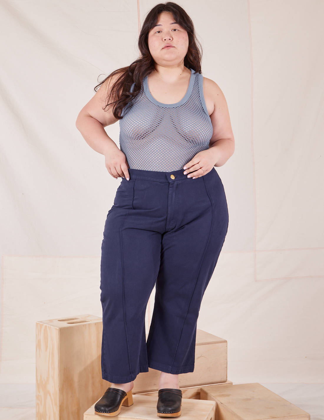 Ashley is wearing Mesh Tank Top in Periwinkle and navy Western Pants