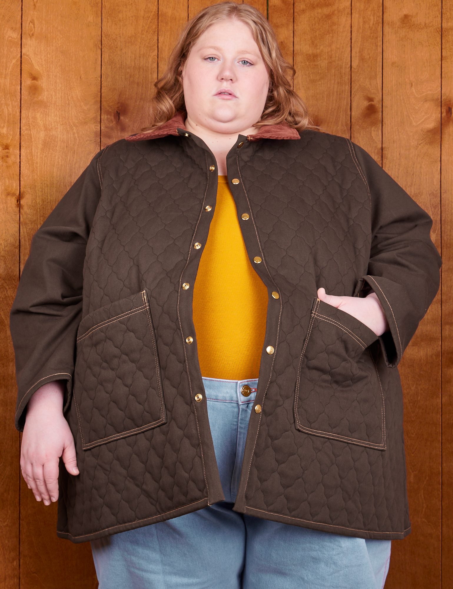 Catie is 5&#39;11&quot; and wearing 5XL Quilted Overcoat in Espresso Brown