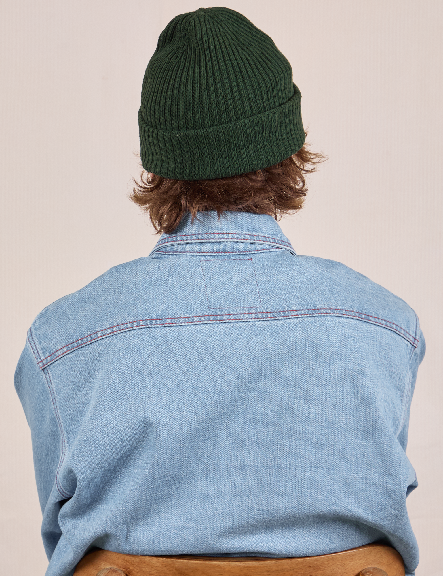 Ribbed Beanie in Swamp Green back view worn by Quinn