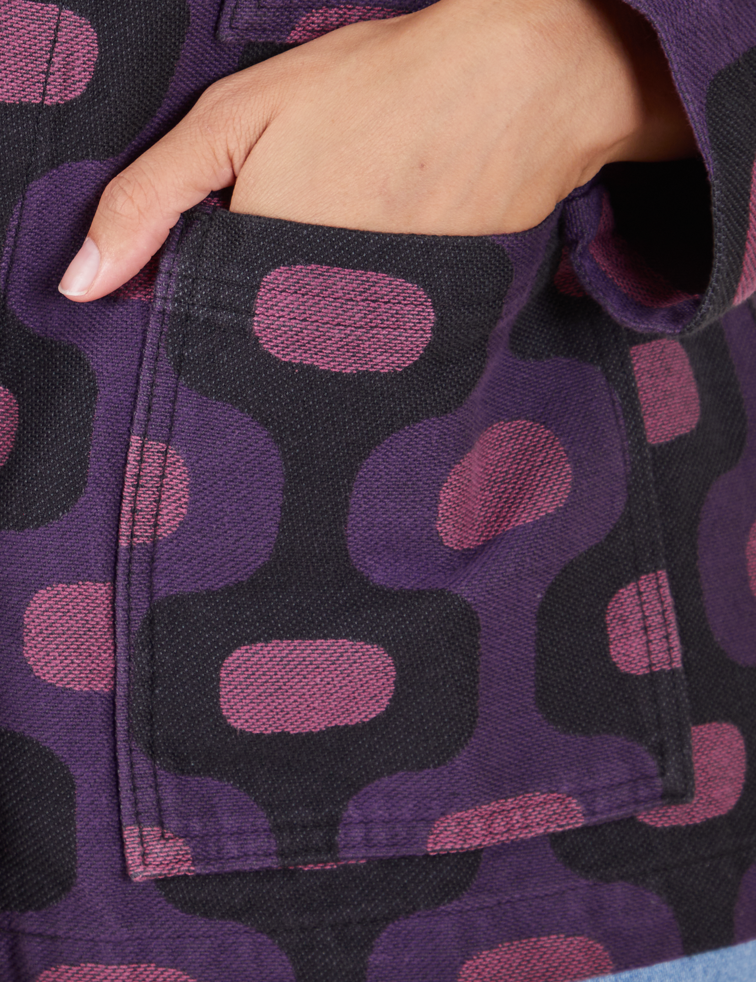  Purple Tile Jacquard Work Jacket front pocket close up. Tiara has her hand in the pocket.