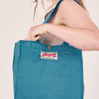 Shopper Tote Bag in Marine Blue worn over shoulder on Allison