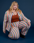 Juliet is wearing Stripe Work Jacket in Rainbow Stripe paired with matching Work Pants