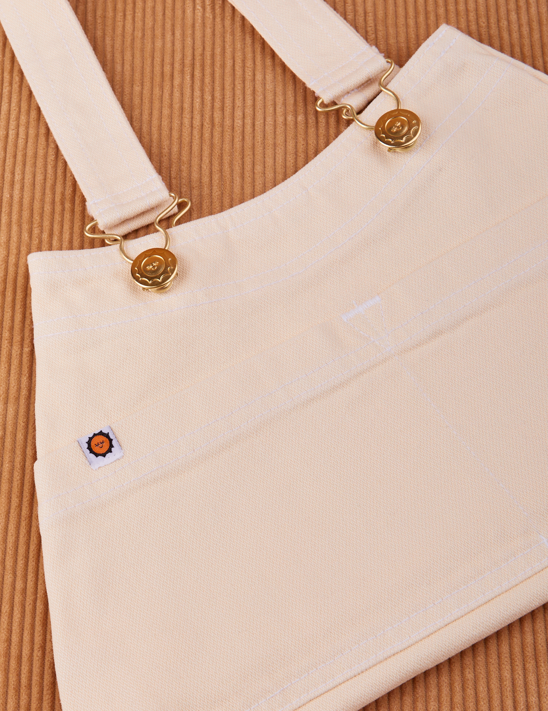 Overall Handbag in Vintage Off-White. Brass sun baby buttons and hardware