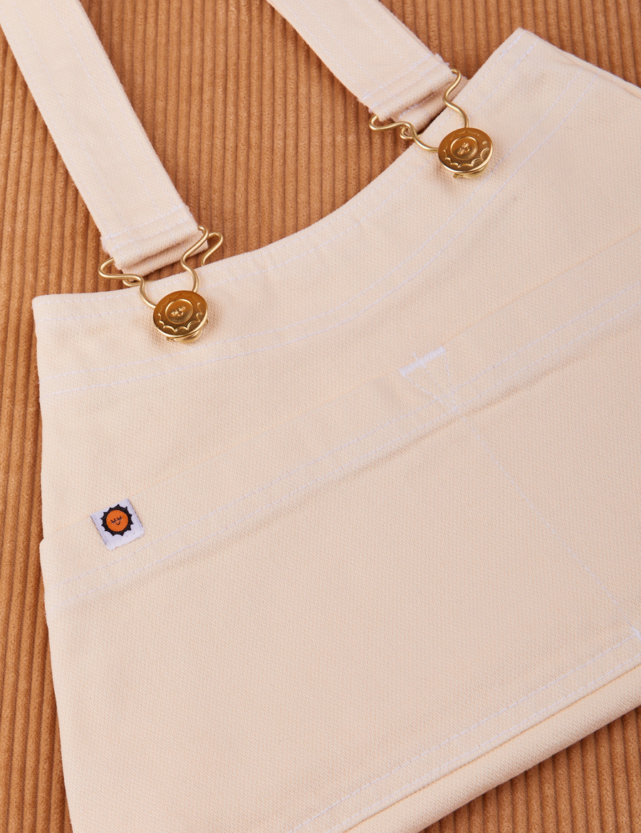 Overall Handbag in Vintage Off-White. Brass sun baby buttons and hardware