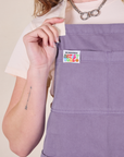 Full Denim Apron in Faded Grape front close up on Alex