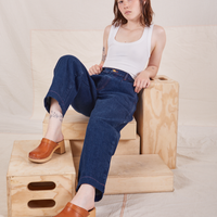 Hana is wearing Denim Trouser Jeans in Dark Wash and vintage off-white Cropped Tank Top