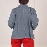 Back view of Railroad Stripe Denim Work Jacket and paprika Western Pants worn by Tiara