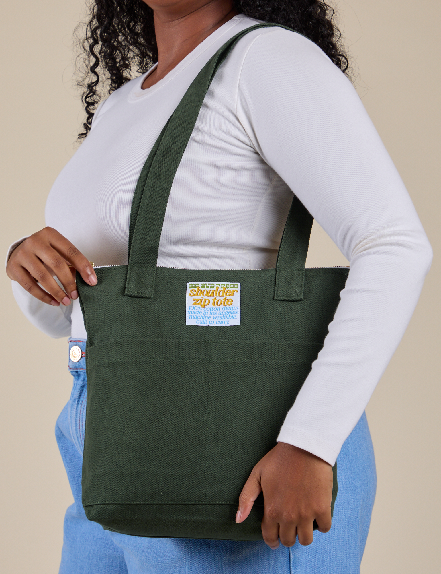 Over-Shoulder Zip Mini Tote in Swamp Green worn on shoulder of model