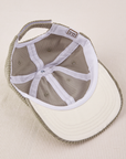 Dugout Corduroy Hat in Khaki Grey flipped over. White satin under-bill