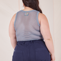 Back view of Mesh Tank Top in Periwinkle and navy Western Pants worn by Ashley