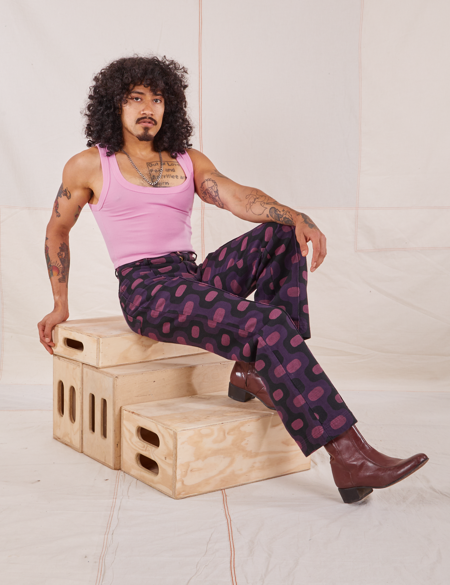 Jesse is wearing Western Pants in Purple Tile Jacquard and bubblegum pink Cropped Tank Top