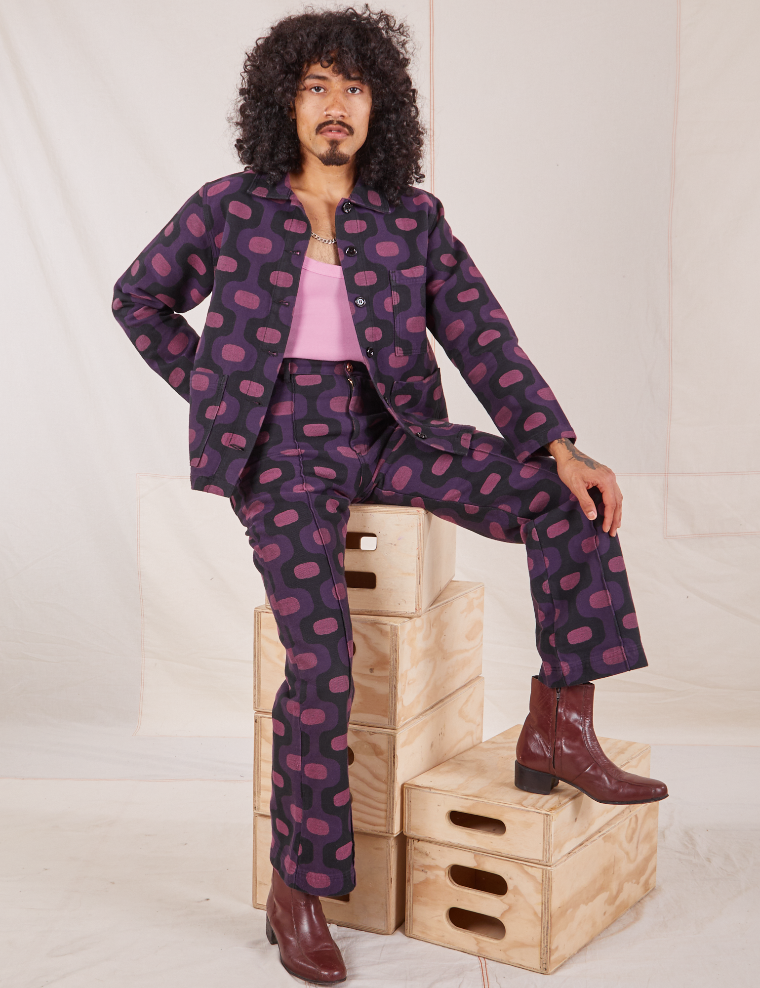Jesse is wearing Western Pants in Purple Tile Jacquard and matching Work Jacket