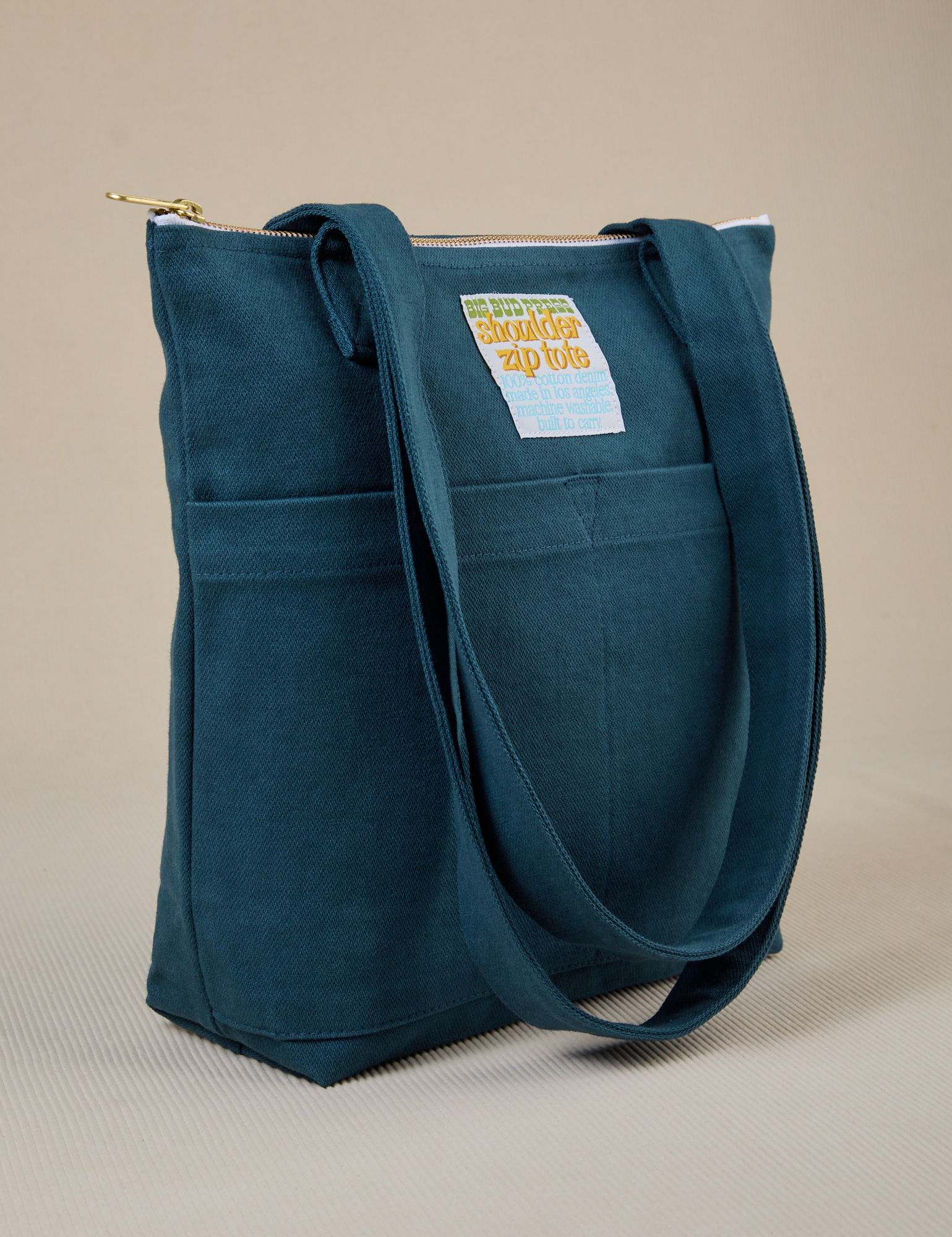 Angled view of Over-Shoulder Zip Mini Tote in Lagoon