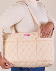 Quilted XL Tote in vintage tee off-white worn on model's shoulder