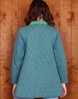Back view of Quilted Overcoat in Marine Blue on Alex