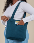 Over-Shoulder Zip Mini Tote in Lagoon worn on shoulder of model