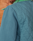 Back shoulder close up of Quilted Overcoat in Marine Blue on Alex