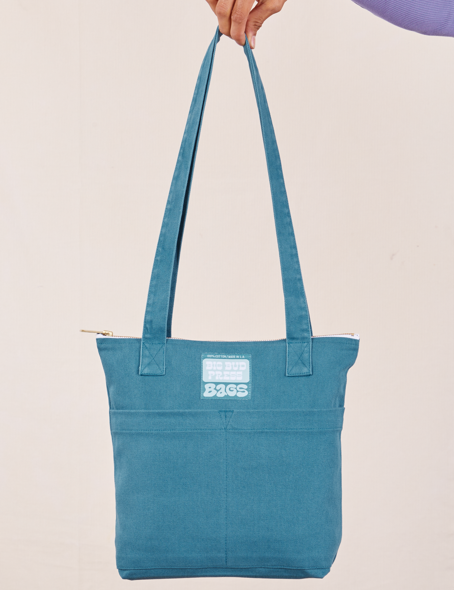 Over-Shoulder Zip Mini Tote in Marine Blue held by model