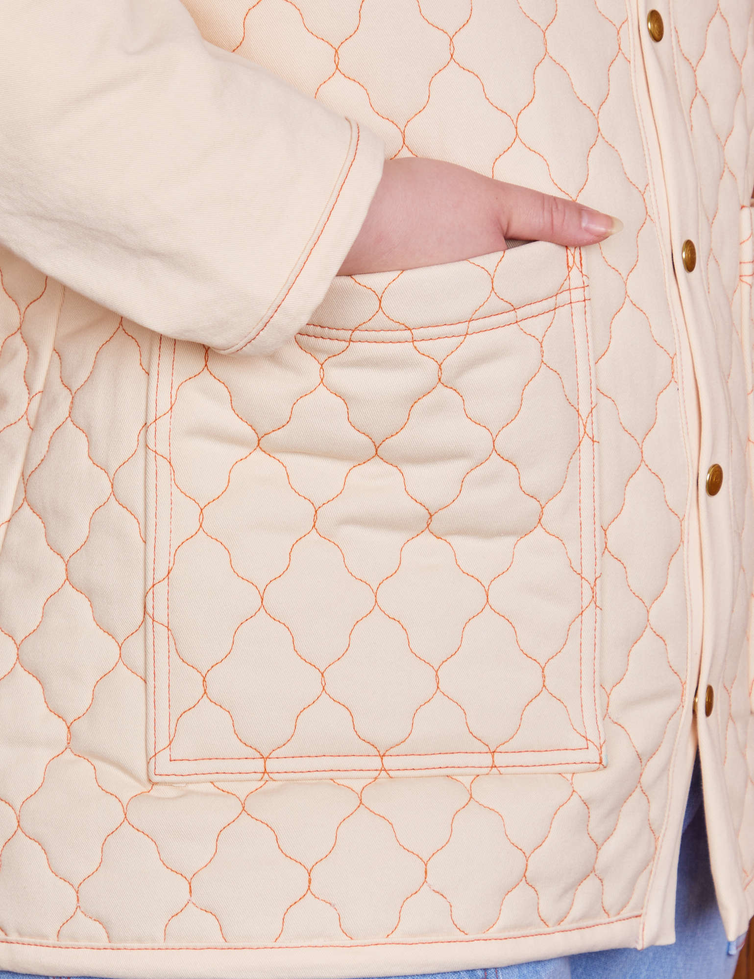 Quilted Overcoat in Vintage Off-White pocket close up with Ashley&#39;s hand in the pocket