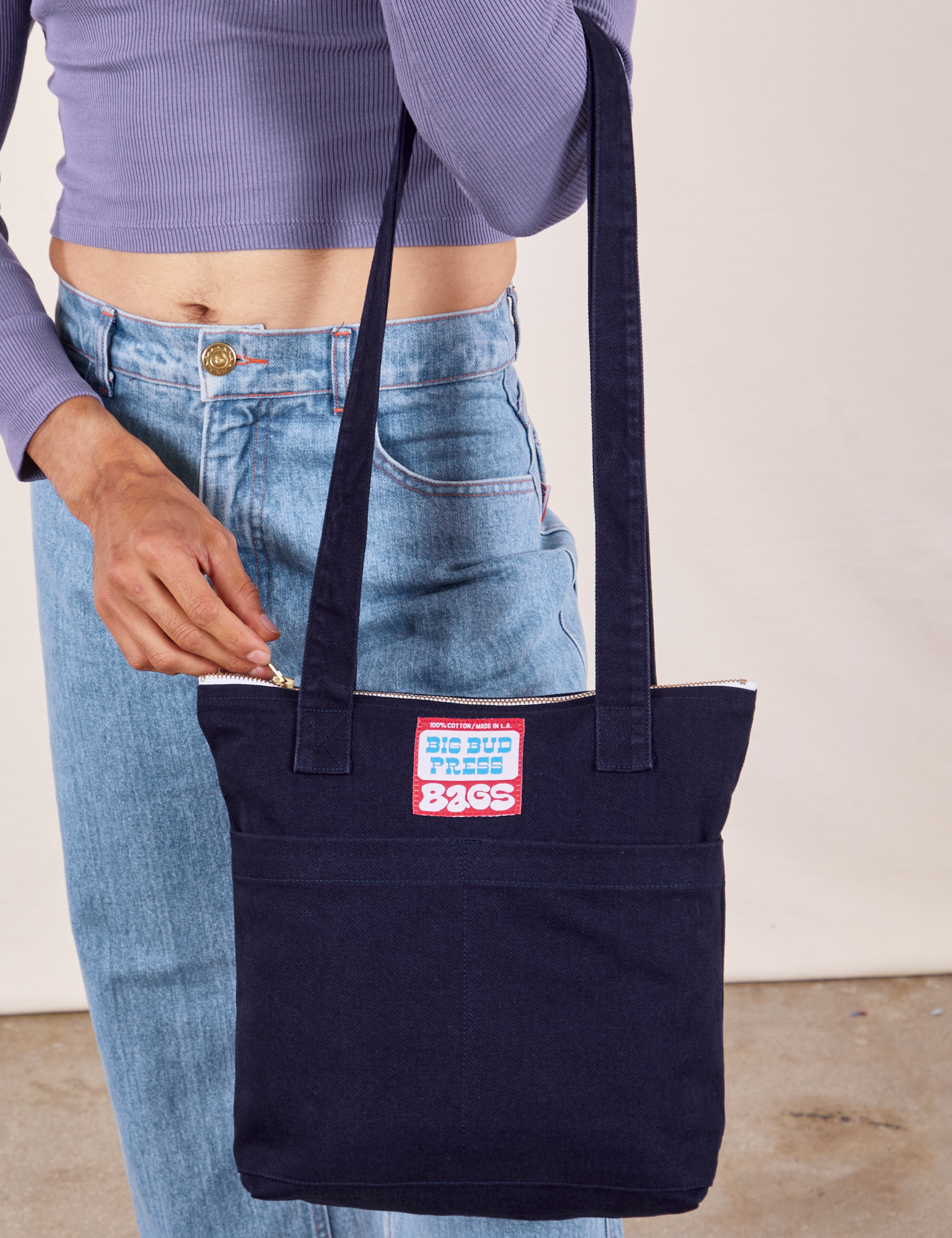 Over-Shoulder Zip Mini Tote in Navy worn on model&#39;s arm