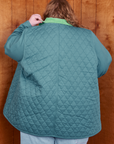Back view of Quilted Overcoat in Marine Blue on Catie