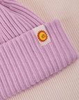 Ribbed Beanie in Lilac close up of sun baby tag