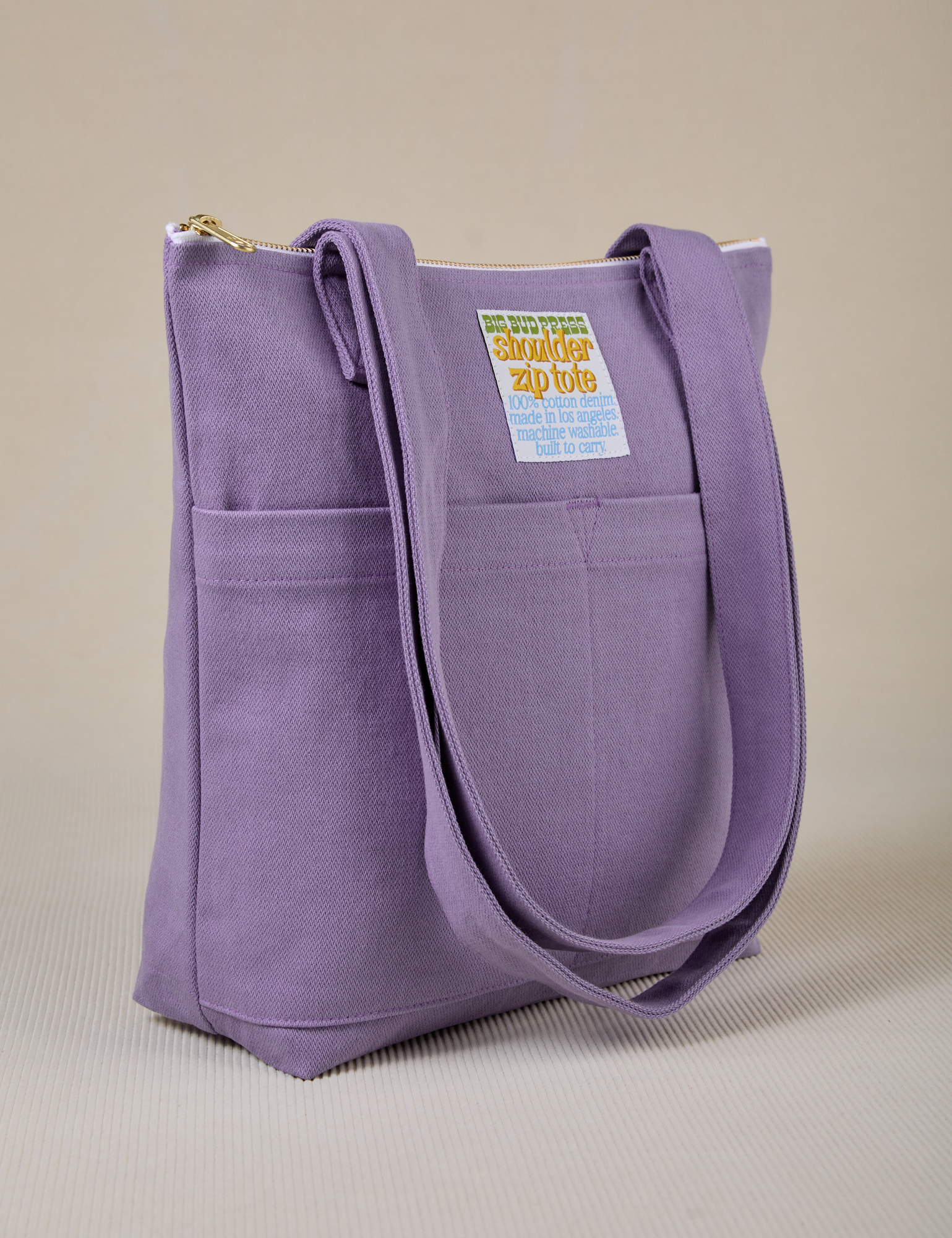 Angled view of Over-Shoulder Zip Mini Tote in Faded Grape