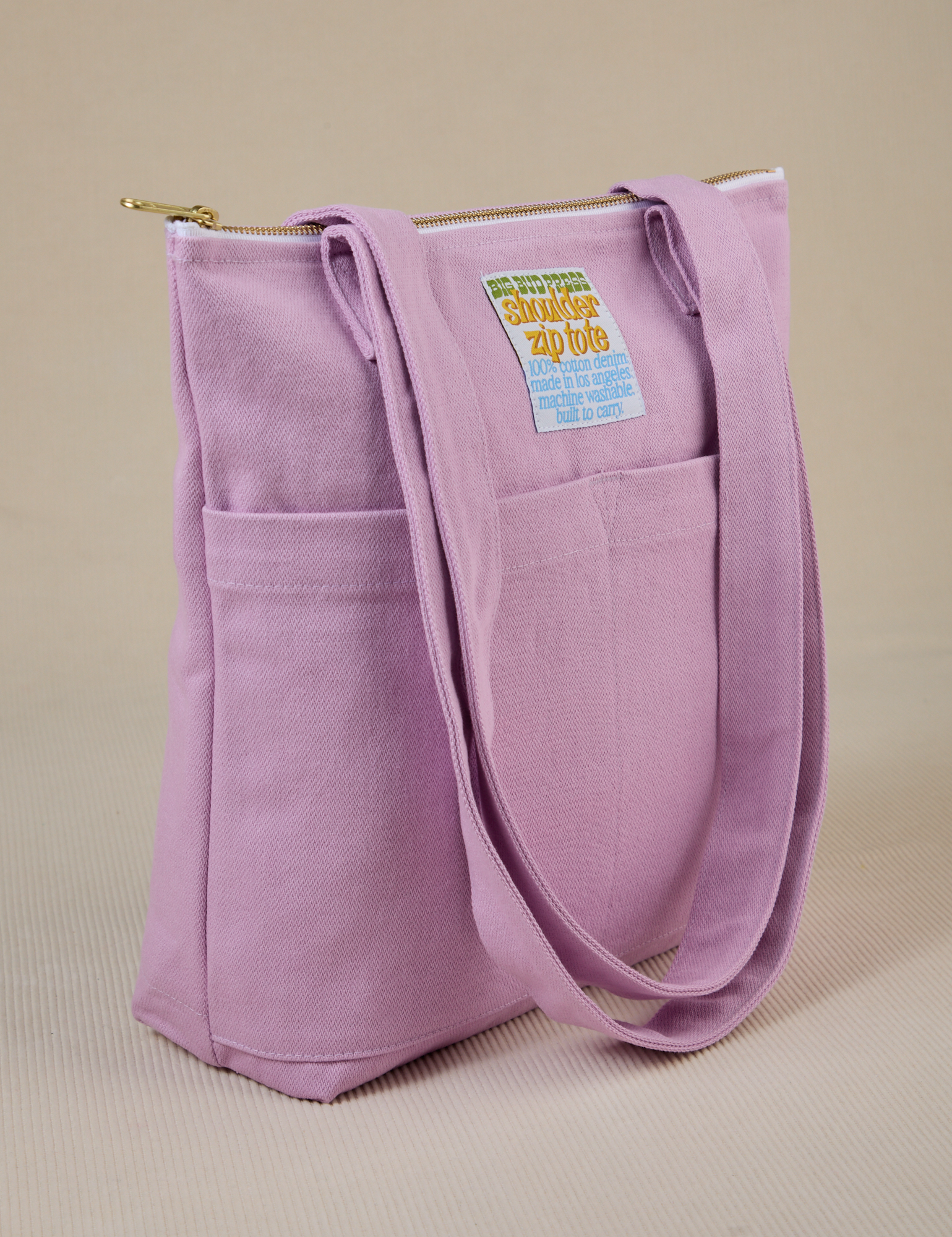 Angled view of Over-Shoulder Zip Mini Tote in Lilac Purple