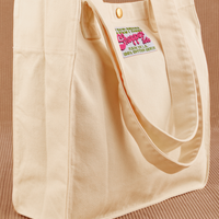 Angled view of Shopper Tote Bag in Vintage Off-White