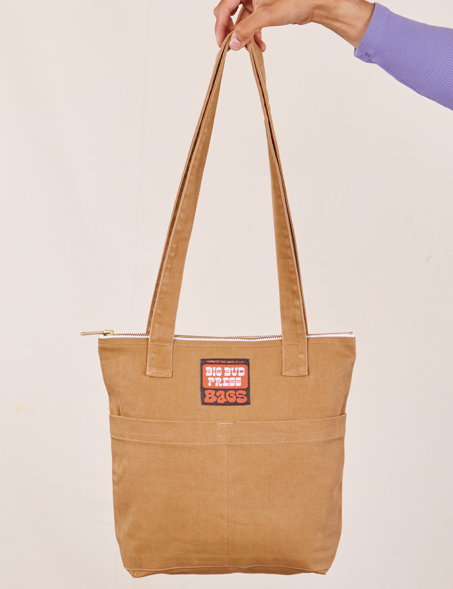 Over-Shoulder Zip Mini Tote in Tan held by model