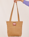 Over-Shoulder Zip Mini Tote in Tan held by model