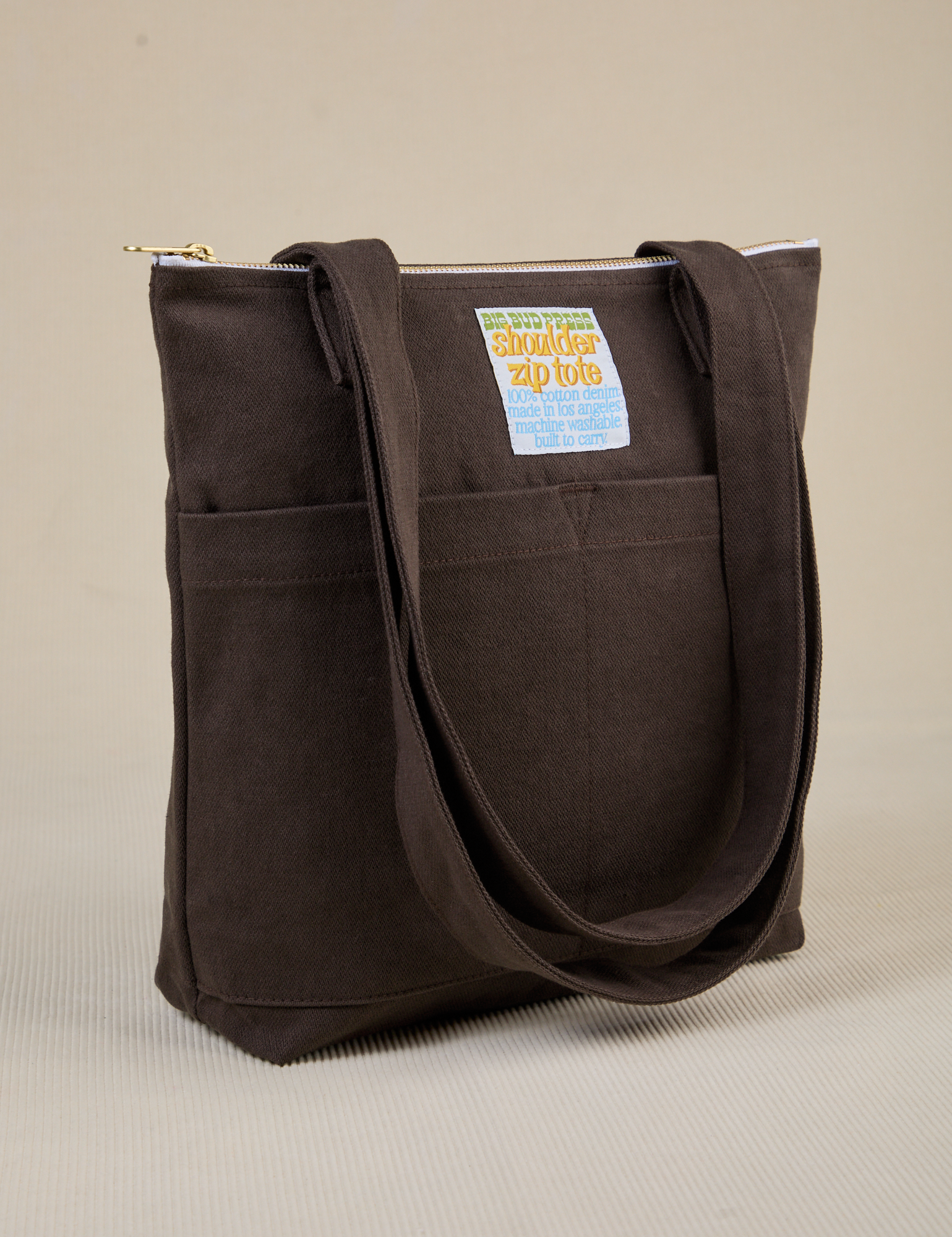 Angled view of Over-Shoulder Zip Mini Tote in Espresso Brown