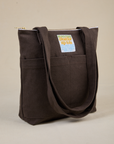 Angled view of Over-Shoulder Zip Mini Tote in Espresso Brown