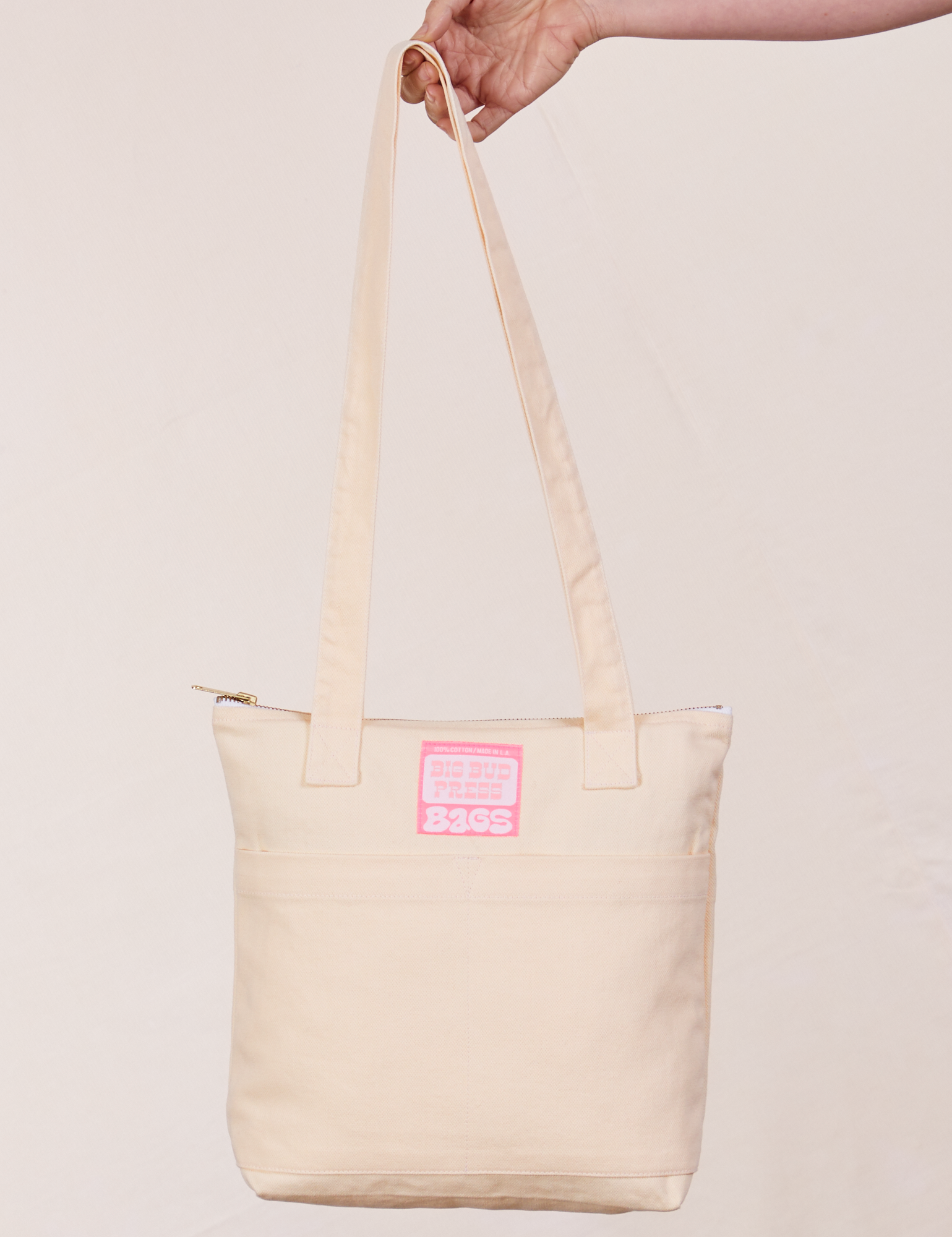 Over-Shoulder Zip Mini Tote in Vintage Off-White held by model