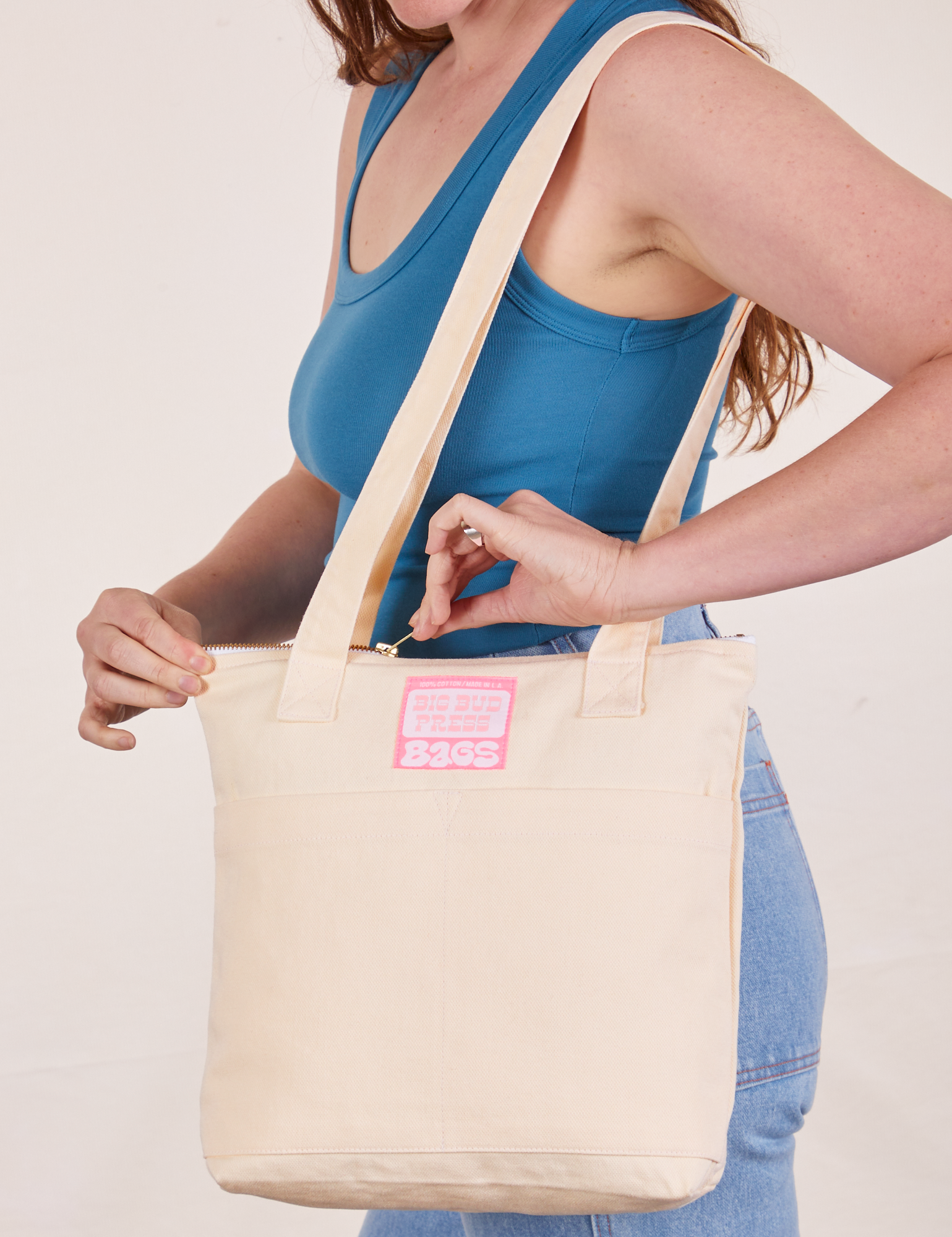 Over-Shoulder Zip Mini Tote in Vintage Off-White worn on shoulder