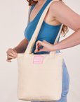 Over-Shoulder Zip Mini Tote in Vintage Off-White worn on shoulder