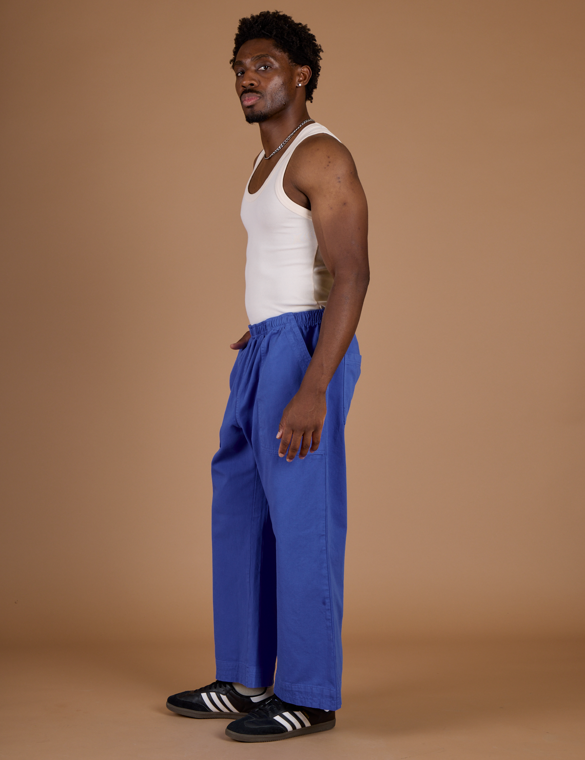 Side view of the Cornflower Blue Action Pant on Isaac