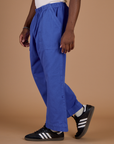 Close up side view of the Cornflower Blue Action Pant on Isaac